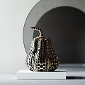 Modern Art Pumpkin Shaped Sculpture Carving With Black Dot Pattern On White Pedestal