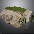 Open Pit Mine Excavation Site With Green Vegetation Sandy Ground And Access Road