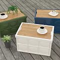 Green Blue White Storage Boxes With Wooden Lids Coffee Cups And Small Potted Plants