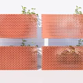 Orange Honeycomb Wall Design With Small Green Plants And Openwork Structure 3d model