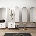Stylish Gold Frame Mirrors with Clothes Rack White Cabinet and Plant on Wooden Floor