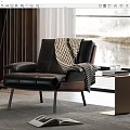 Black Leather Leisure Chair with Plaid Blanket and Side Table with Glasses Books by Window