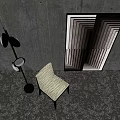Light Textured Leisure Chair With Black Floor Lamp And Geometric Pattern On Gray Concrete Wall