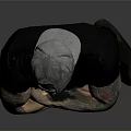 Tattooed Man Wearing Black T Shirt And Pants With Arms Crossed Against Gray Background