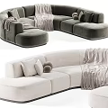 Modern Curved Sectional Sofa With Neutral Tone Upholstery Decorative Pillows And Soft Blankets