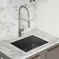 Modern Kitchen With Stylish Gray And White Cabinets Featuring Marble Countertops And Built In Appliances