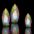 Colorful Iridescent Crystal Like Landscape Sculptures With Golden Base And Reflections On Black Background