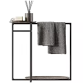 Daily Washing Essentials On Black Metal Stand With Soap Bottle And Gray Towel