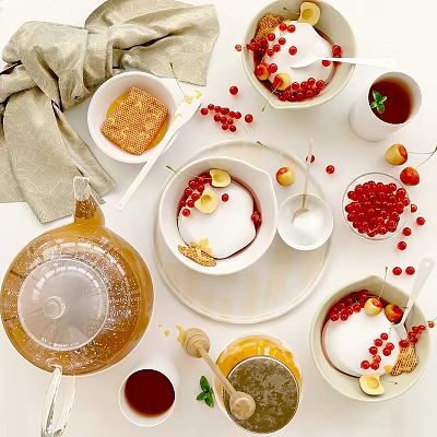 Delicious Cream Dessert Topped With Honey Red Currants And Lemon Slices On White Table 3d model