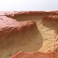 Red Rock Garden Landscape With Gullies Yellow Sand And Natural Textures