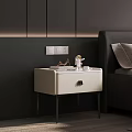 Modern White Bedside Table With Metal Legs And Decorative Items In Bedroom