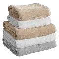 Stacked Soft Towels in Beige White and Gray Colors for Bathroom Use