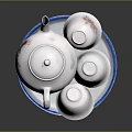 White Ceramic Teapot With Three Cups On Blue Rimmed Tray For Daily Use