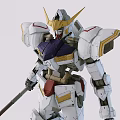 White Gundam Model With Gold Accents Holding Large Spear And Long Sword