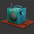 Blue Portable Radio Style Speaker with Antenna Pink Buttons and Cartoon Pattern on Red Mat