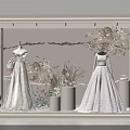 Elegant Bridal Shop Window Display With Lace Wedding Dresses And Floral Decorations