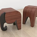 Two Elephant Shaped Wooden Stools With Brown Body And Black Legs