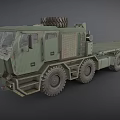 Green Military Truck with Flatbed Trailer Spare Tire on Top and Multiple Large Wheels