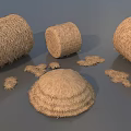 Round Hay Bales And Scattered Hay Piles In Natural Rural Setting
