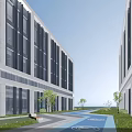 Modern Industrial Factory Buildings With Large Glass Windows And Greenery Surrounding Pathway