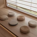 Round Woven Stools On Wooden Floor Near Window In Modern Minimalist Indoor Space