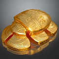Carved Golden Turtle Sculpture with Intricate Details and Surrounding Gold Coins