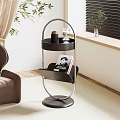 Black Two Tiered Side Table With Metal Frame Round Base And Magazine On Lower Shelf