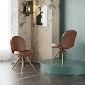 Brown Leather Dining Chairs With Curved Back And Brass Legs In Modern Room