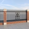 Black Iron Fence With Decorative Pattern And Red Brick Pillars Stone Base 3d model
