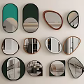 Various Shaped Mirrors With Black Green Brown Frames Reflecting Room Interiors