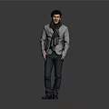 Handsome Man Dressed in Gray Jacket and Black Pants Standing Against Gray Background With Scarf