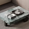 Green Marble Coffee Table with Black Legs Tray Glasses and Books on Rug