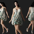 Woman In White Sleeveless Green Floral Print Short Dress With High Heels