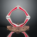 Geometric Decorative Ornament With Red And Silver Frame On Wooden Base