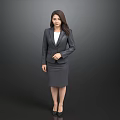 Professional Woman In Gray Business Suit Standing Against Dark Background