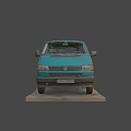 Turquoise Vintage Volkswagen Van Parked On Gravel Ground With Grass Around