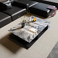 Modern Marble Top Coffee Table In Living Room With Black Leather Sofa And Decorative Accents