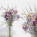 Purple and White Flowers in Transparent Glass Vase with Green Grasses for Home Decor