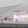 Contemporary Exhibition Hall Interior With Wall Mounted Image Displays And People