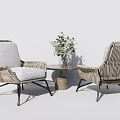 Modern Rattan Table and Chairs Set Featuring Gray Cushions Black Metal Legs and Vase Flowers