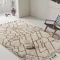 Square Rug With Geometric Pattern And Tassel Edges In Modern Interior With Side Chair And Books