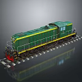 Green Locomotive With Yellow Stripes And Red Bottom On Railway Tracks Gray Background Reflection