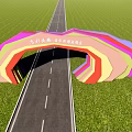 Multicolored Arched Entrance Gate with Rainbow Design and Green Fields Along Long Road