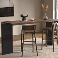 Modern Bar Counter With Wooden Top Black Columns Three Bar Stools And Decorative Dried Flowers