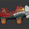 Vintage Red Metal Toy Car With Airplane Design And Yellow Wheels