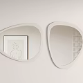 Two Irregular Shaped White Frame Mirrors Reflecting Artwork and Grid Cabinet in Wall Decor
