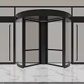Modern Revolving Door With Black Frame And Glass Panels On Marble Floor