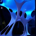 Modern White Illuminated Sculptural Art With Curved Hollow Design In Indoor Space