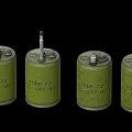 Four Green Cylindrical Military Weapons With Numbered Markings And Metal Caps
