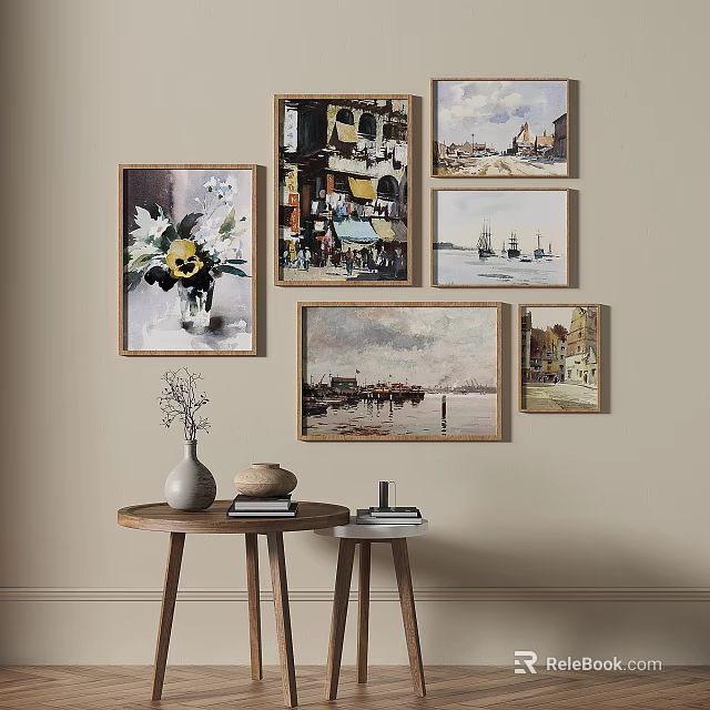 Wall With Multiple Framed Paintings And Small Table With Vase And Books 3d model 